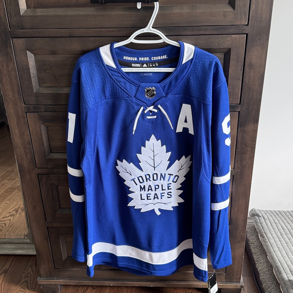 Autographed Tavares Blue NHL game Jersey- Authentic TML Game Jersey & autograph.